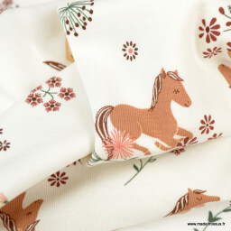 Tissu jersey motifs chevaux et fleurs fond blanc cassé - oeko tex