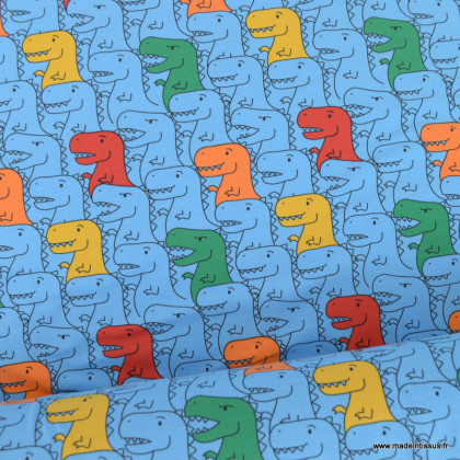Tissu jersey motif dinosaures multicouleurs fond bleu - oeko tex