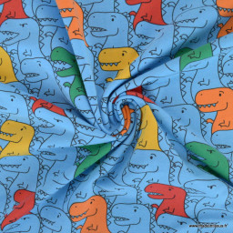 Tissu jersey motif dinosaures multicouleurs fond bleu - oeko tex