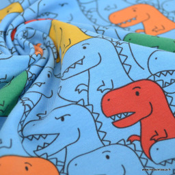 Tissu jersey motif dinosaures multicouleurs fond bleu - oeko tex