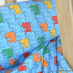 Tissu jersey motif dinosaures multicouleurs fond bleu - oeko tex