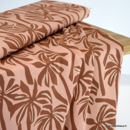 Tissu Viscose motif palmiers exotiques fond pêche