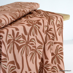 Tissu Viscose motif palmiers exotiques fond pêche