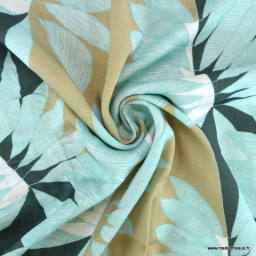 Tissu Satin de viscose motif feuilles exotiques beige et bleu