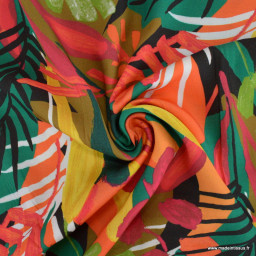 Tissu Satin de viscose motif feuilles exotiques orange, rouge et vert