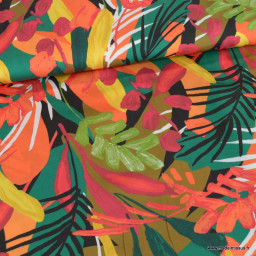 Tissu Satin de viscose motif feuilles exotiques orange, rouge et vert