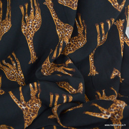 Tissu popeline de Viscose motif girafes fond noir