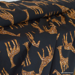 Tissu popeline de Viscose motif girafes fond noir