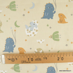 Tissu coton Amagara imprimé Dinosaures fond beige - Oeko tex