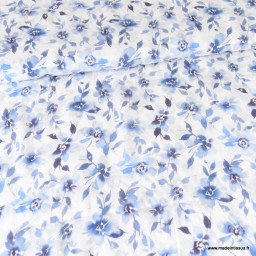 Tissu plumetis de viscose motifs fleurs bleues fond blanc