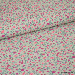 Tissu popeline de Viscose motif petites fleurs roses fond vert menthe