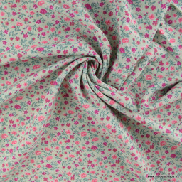 Tissu popeline de Viscose motif petites fleurs roses fond vert menthe