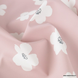 Tissu imperméable type ciré motif fleurs Jexy fond rose