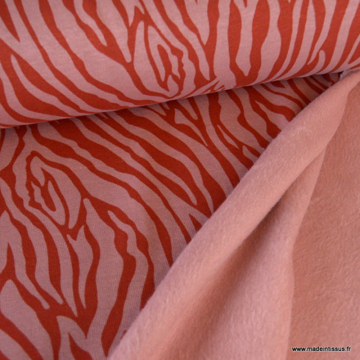 Tissu Sweat molleton motif zèbre - corail foncé