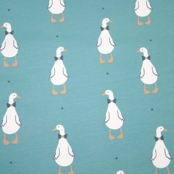 Tissu jersey motif canard fond bleu