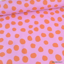 Tissu coton Enduit motifs Pois oranges fond rose