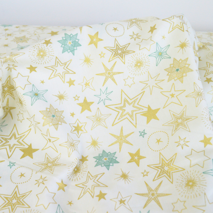 Tissu de Noël Edmé motif étoiles Or fond Blanc cassé - Oeko tex