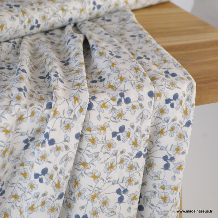 Tissu Viscose Fleurette motif fleur bleu fond Crème